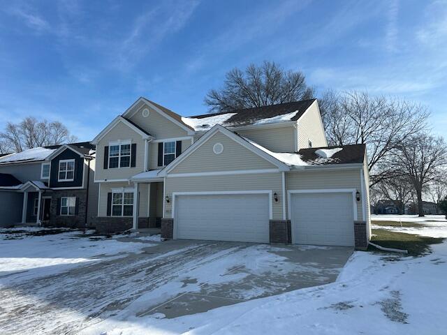 13131 Rutledge Place Crown Point, IN 46307 - Photo 2 of 25 a front view of a house with a yard and garage