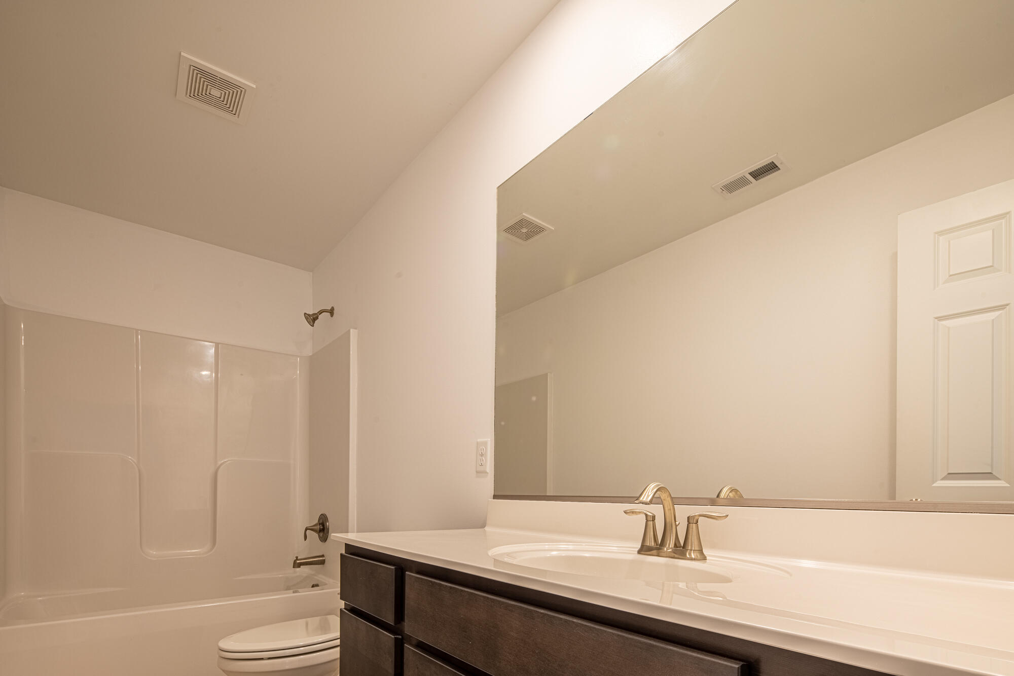 13131 Rutledge Place Crown Point, IN 46307 - Photo 22 of 25 a bathroom with a sink a toilet and a tub