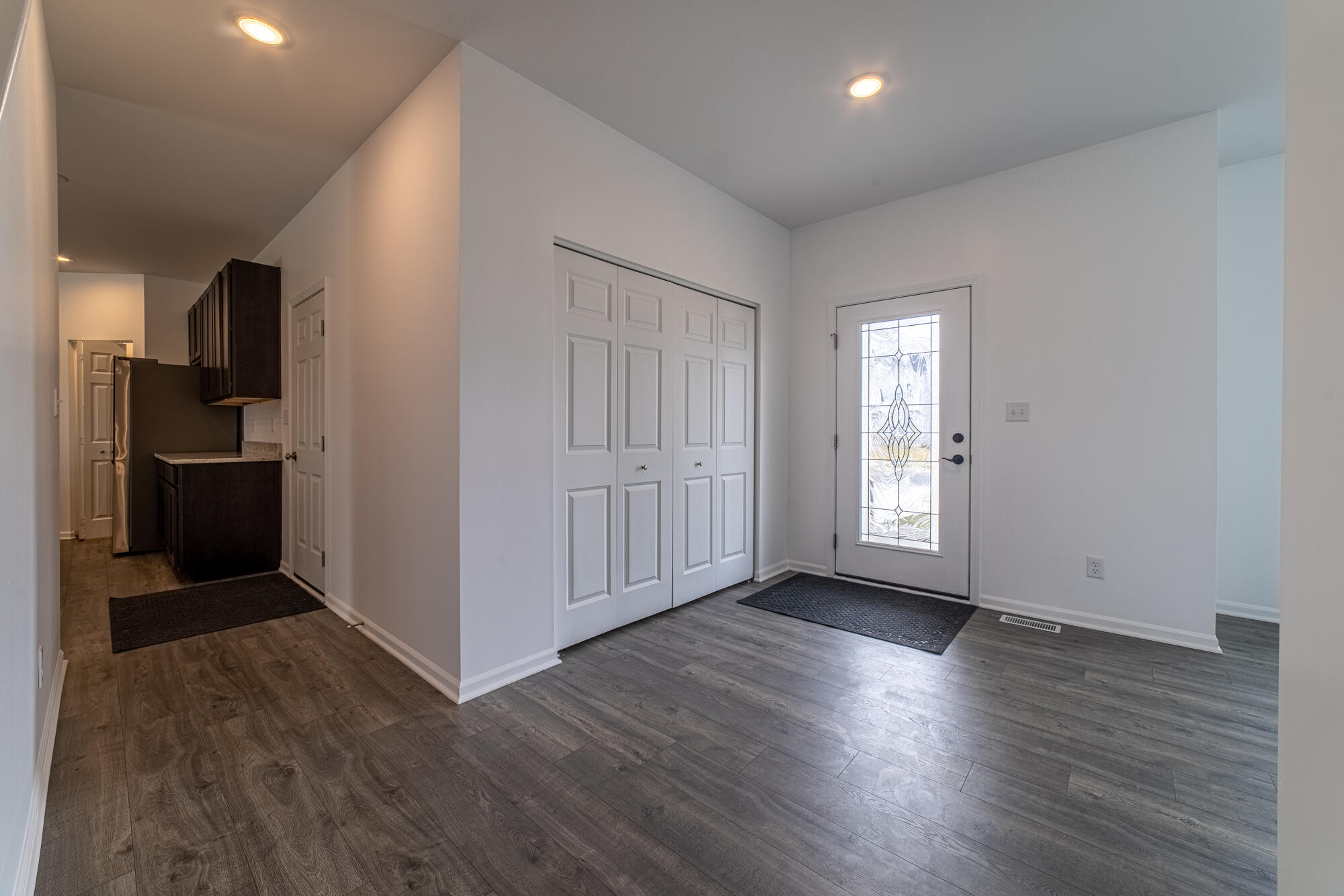 13131 Rutledge Place Crown Point, IN 46307 - Photo 7 of 25 a view of entryway with wooden floor