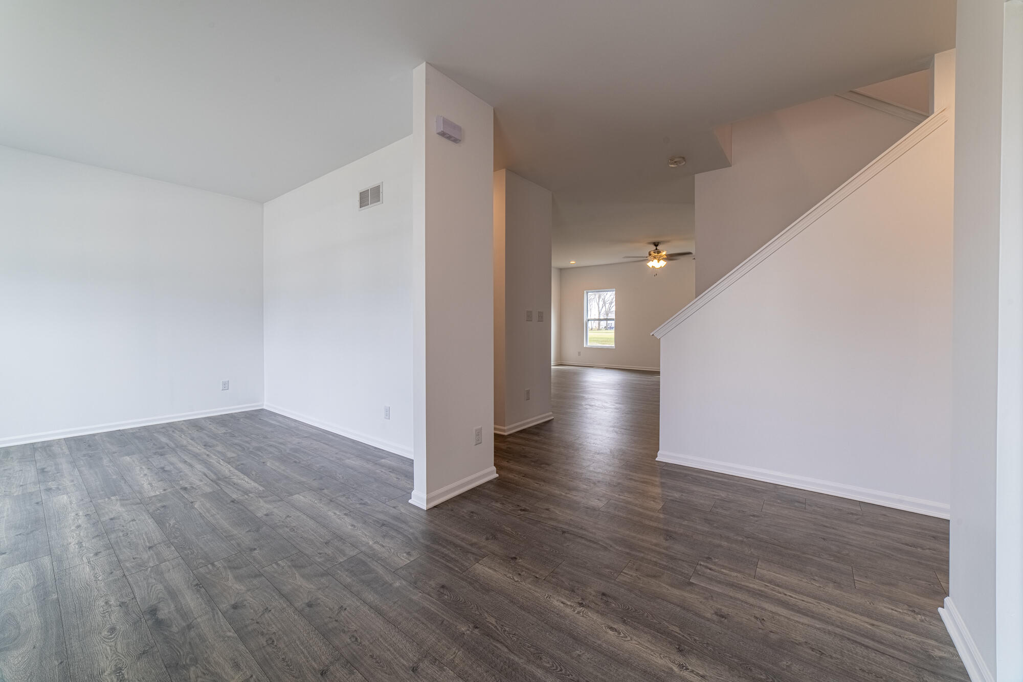 13131 Rutledge Place Crown Point, IN 46307 - Photo 8 of 25 a view of a hallway with wooden floor