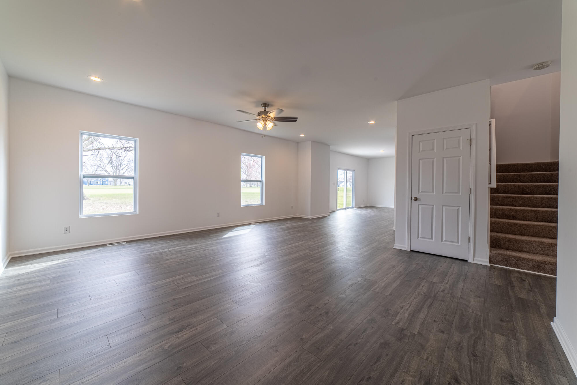 13131 Rutledge Place Crown Point, IN 46307 - Photo 9 of 25 an empty room with wooden floor closet and windows