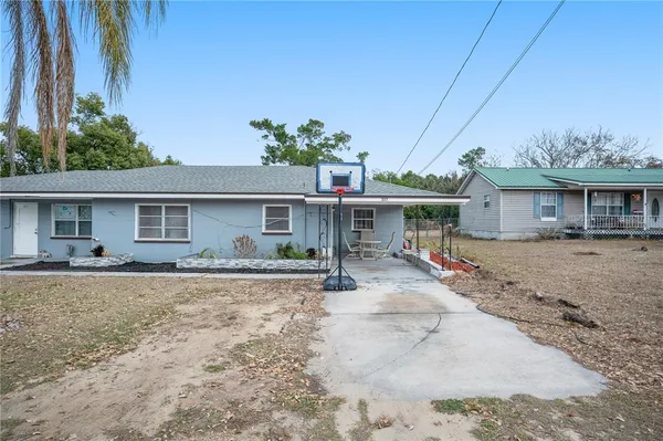 front view of a house with a patio