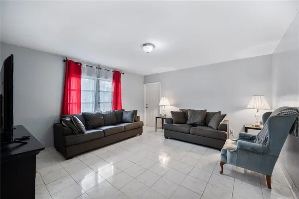 a living room with furniture and a couch