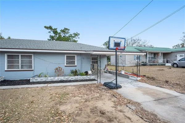 a front view of house with yard and seating space