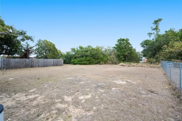 a view of backyard with green space