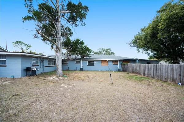 a house with trees in the background