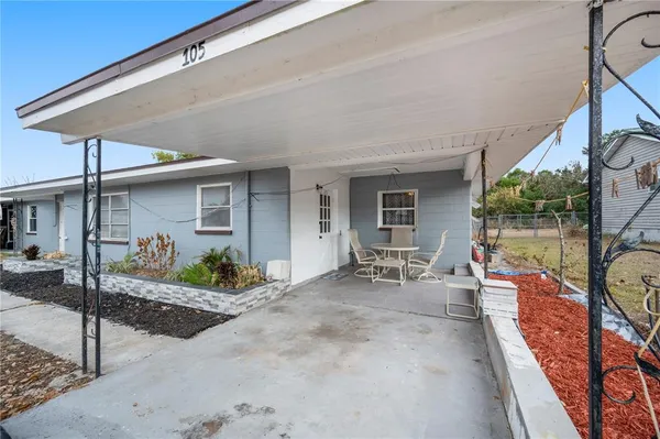 a front view of a house with patio