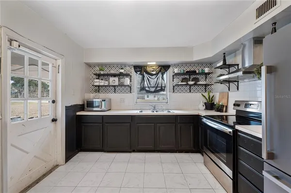 a kitchen with a sink and cabinets