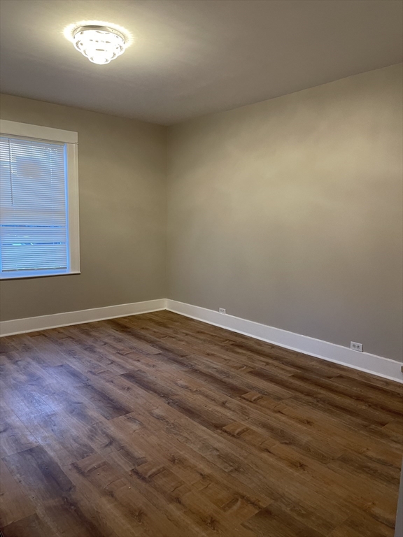 52 Houghton Street, Unit 1 Worcester, MA 01604 - Photo 14 of 15 an empty room with wooden floor and windows
