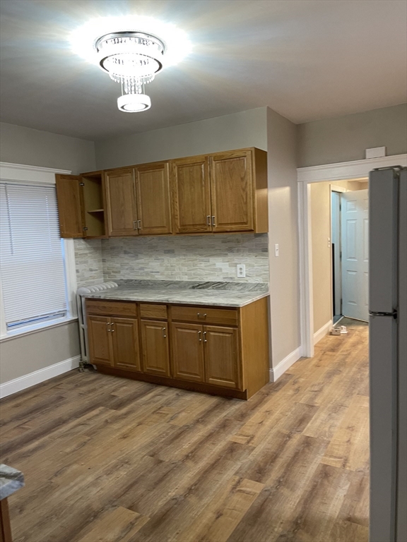 52 Houghton Street, Unit 1 Worcester, MA 01604 - Photo 3 of 15 a kitchen with a refrigerator and a sink