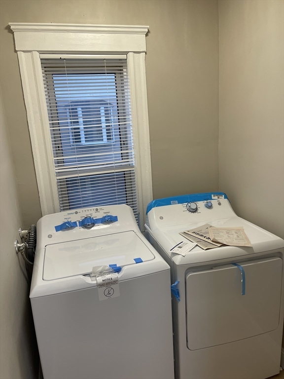 52 Houghton Street, Unit 1 Worcester, MA 01604 - Photo 4 of 15 a utility room with dryer and washer