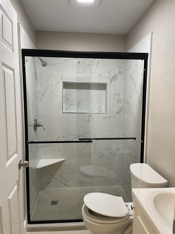 52 Houghton Street, Unit 1 Worcester, MA 01604 - Photo 9 of 15 a bathroom with a toilet and a shower