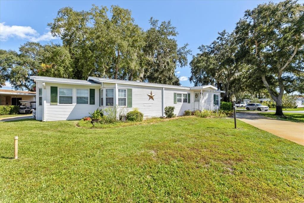 633 Starboard Avenue Edgewater, FL 32141 - Photo 1 of 57 a view of a house with backyard and sitting area