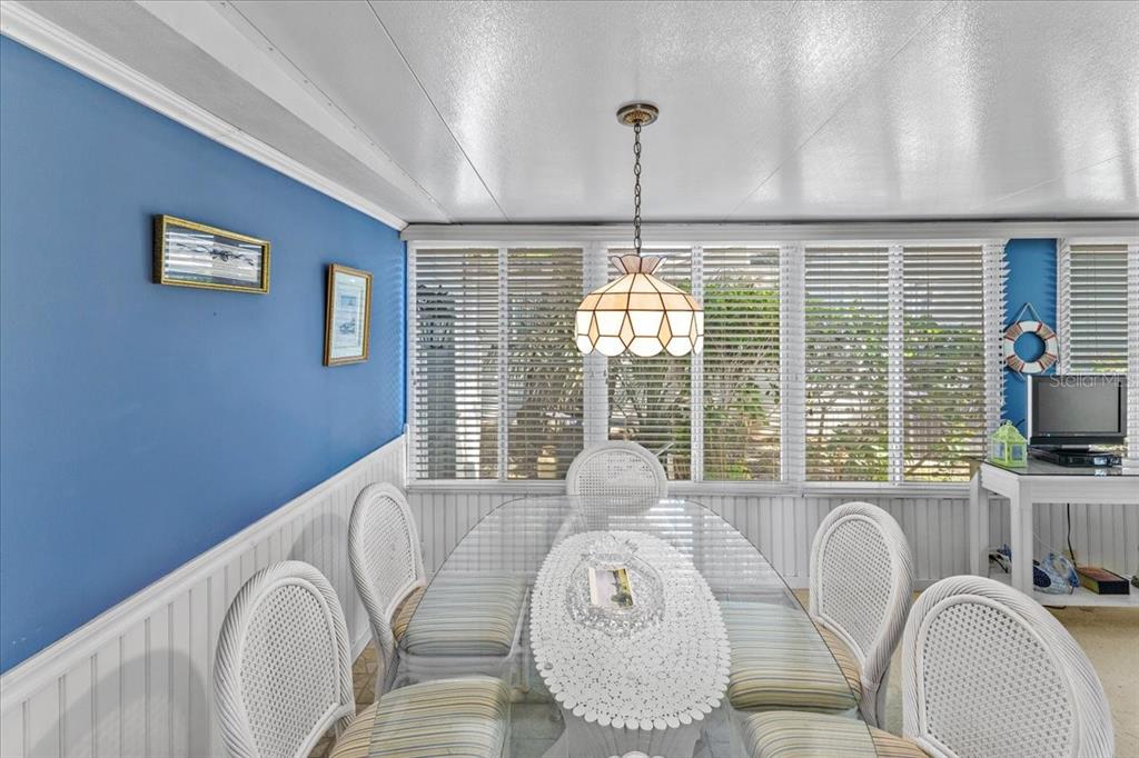 633 Starboard Avenue Edgewater, FL 32141 - Photo 11 of 57 a very nice looking dining room with a large window