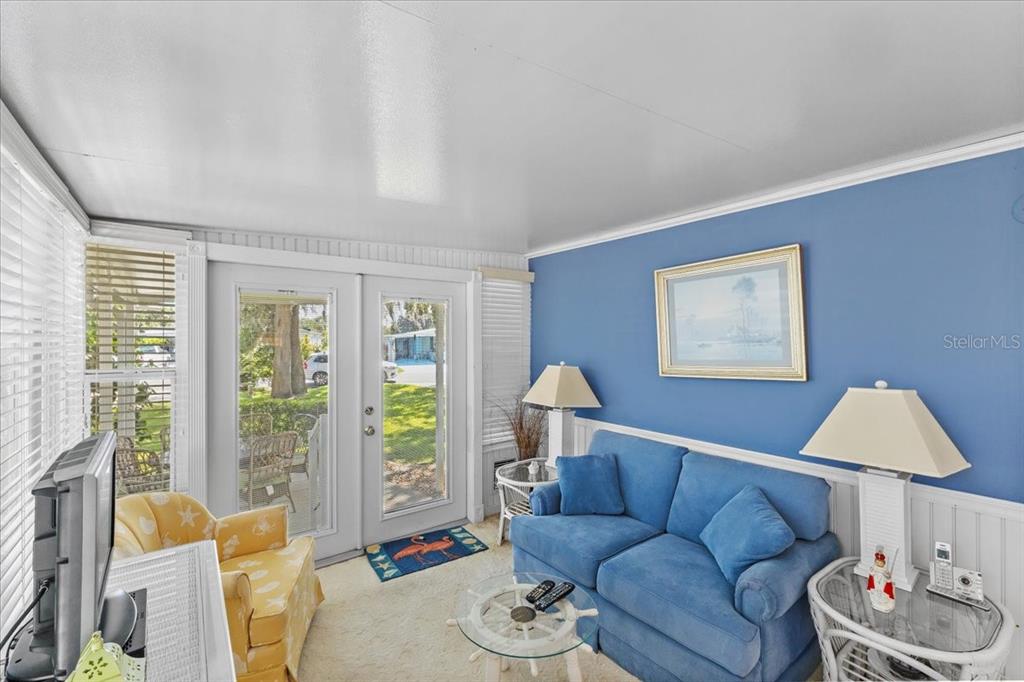 633 Starboard Avenue Edgewater, FL 32141 - Photo 13 of 57 a living room with furniture and a window