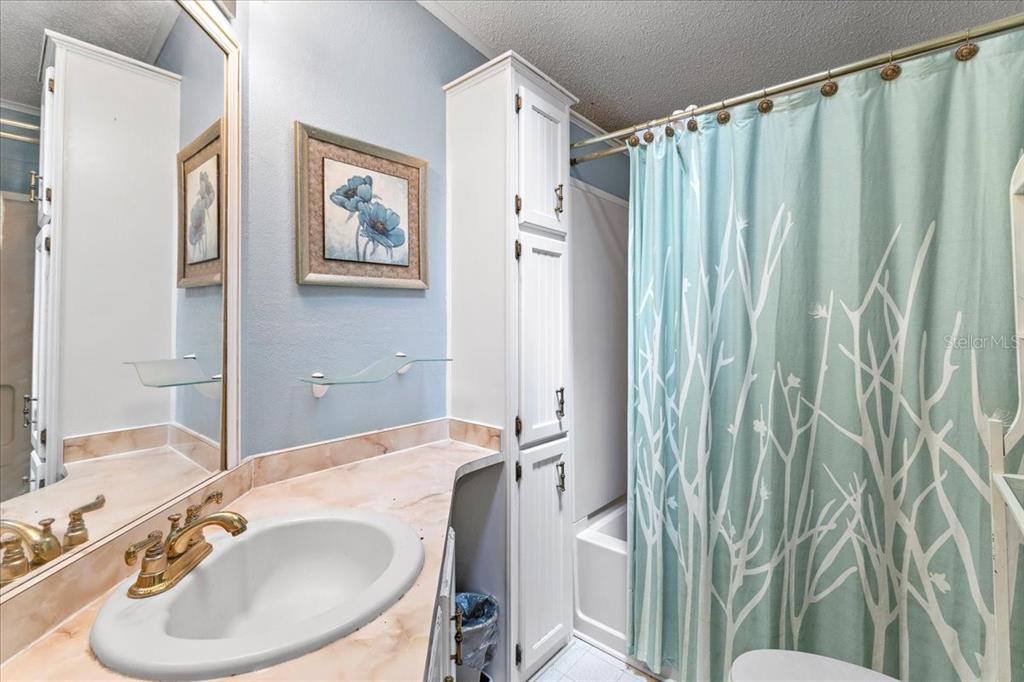 633 Starboard Avenue Edgewater, FL 32141 - Photo 16 of 57 a bathroom with a sink and a mirror