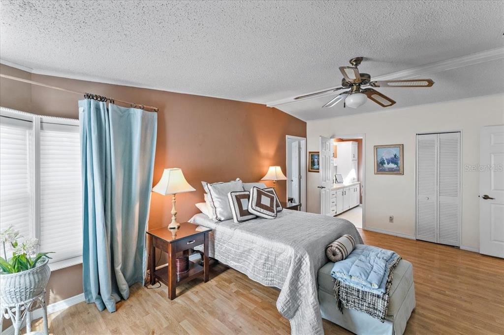 633 Starboard Avenue Edgewater, FL 32141 - Photo 19 of 57 a bedroom with furniture and a wooden floor