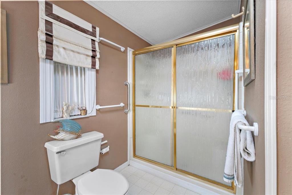 633 Starboard Avenue Edgewater, FL 32141 - Photo 21 of 57 a bathroom with a toilet and a shower