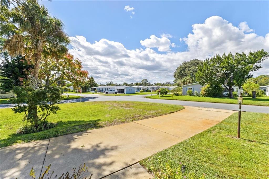 633 Starboard Avenue Edgewater, FL 32141 - Photo 28 of 57 a view of a swimming pool and trees in the background