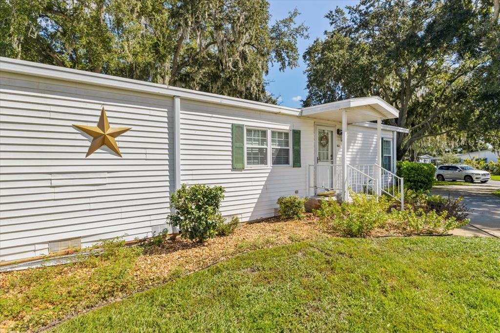633 Starboard Avenue Edgewater, FL 32141 - Photo 3 of 57 a view of a house with a yard