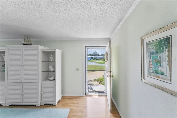 a view of an empty room and a window