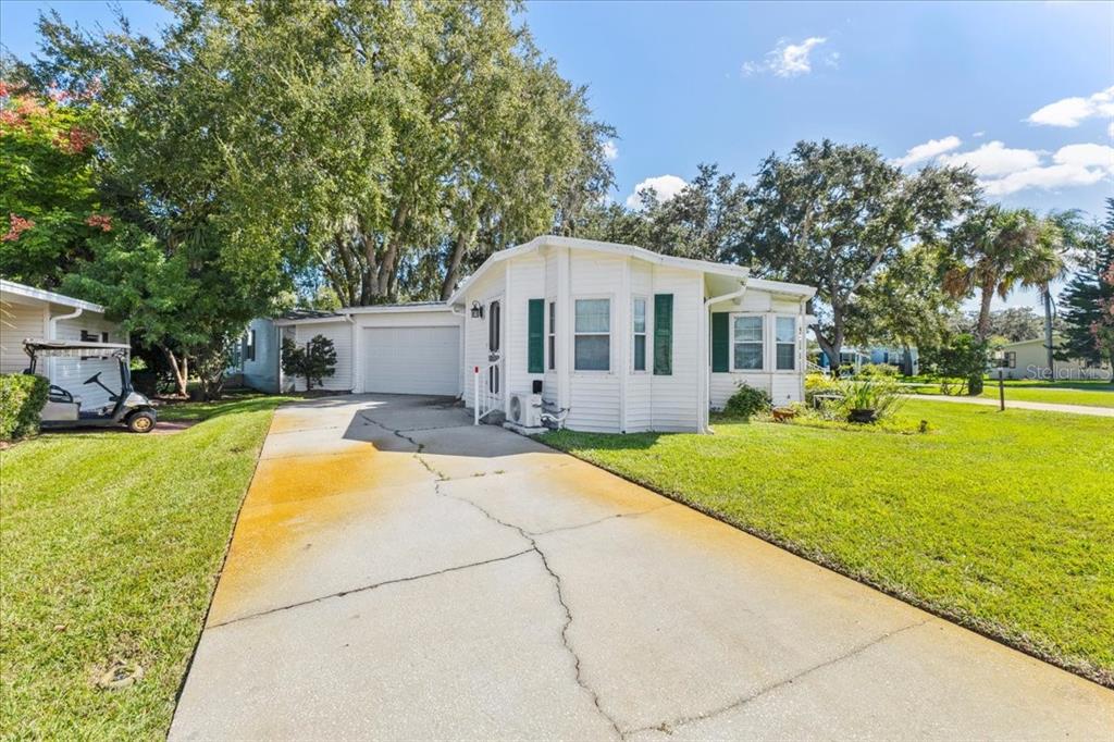 633 Starboard Avenue Edgewater, FL 32141 - Photo 52 of 57 a front view of a house with a garden and patio