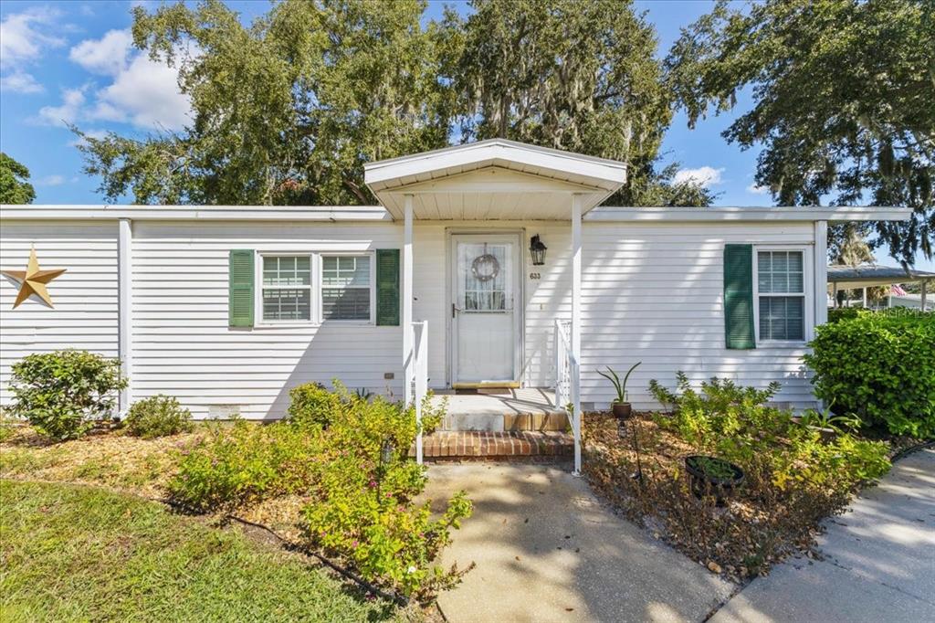 633 Starboard Avenue Edgewater, FL 32141 - Photo 54 of 57 a front view of a house with garden