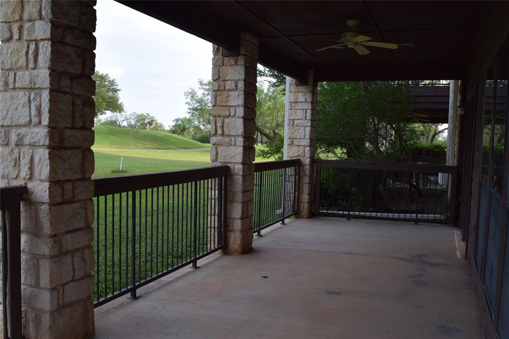 27101 Meadowmore Court Whitney, TX 76692 - Photo 22 of 32 Large fenced, covered back patio.