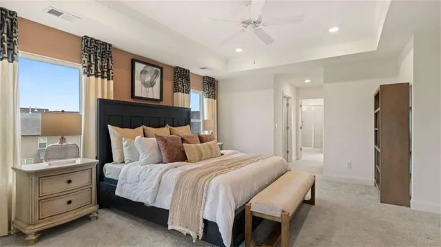 a bedroom with a bed and a painting on the wall