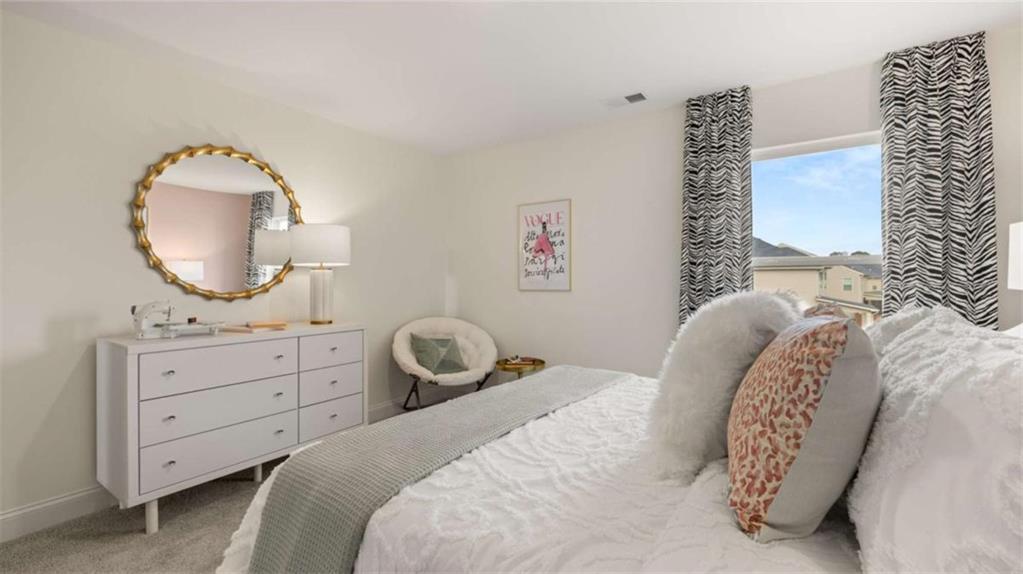 1770 Goodwin Drive Hampton, GA 30228 - Photo 65 of 79 a bedroom with a bed and a dresser