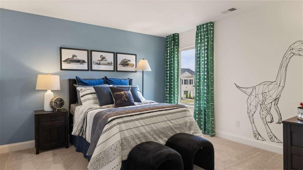 1770 Goodwin Drive Hampton, GA 30228 - Photo 66 of 79 a bedroom with a bed and a painting on the wall