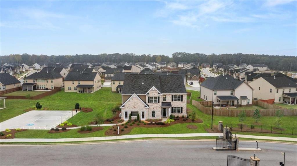 1770 Goodwin Drive Hampton, GA 30228 - Photo 7 of 79 an aerial view of a house with a garden and lake view