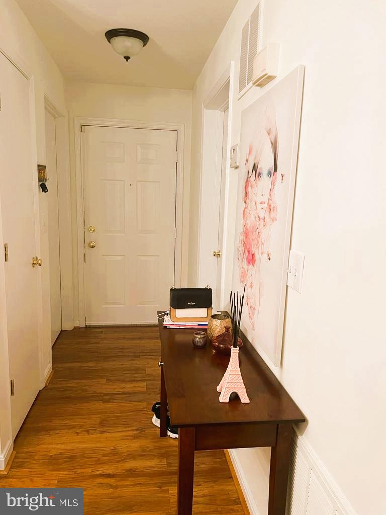 1043 Gardenview Loop, Unit 203 Woodbridge, VA 22191 - Photo 5 of 7 a bathroom with a sink and a mirror