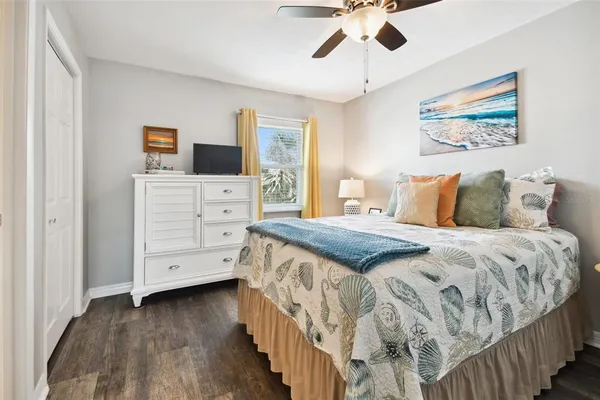 a bedroom with a bed and a dresser