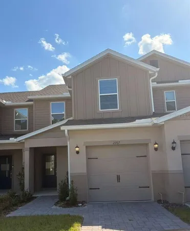 a front view of a house with yard
