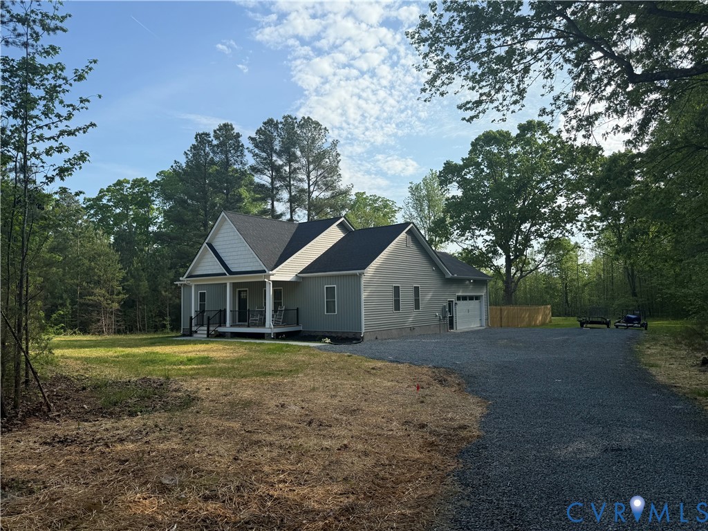 4316 Mt Airy Road Louisa, VA 23093 - Photo 2 of 45 a front view of a house with a yard and large trees