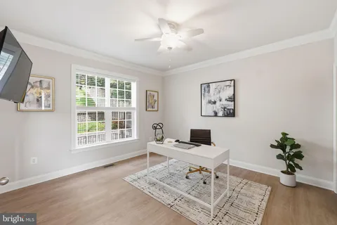 a workspace with furniture and window