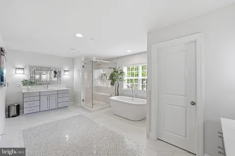 a large white room with a large window and walk in closet