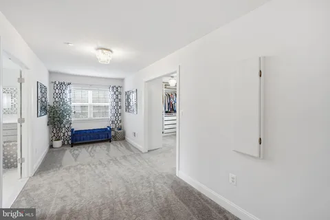 a living room with furniture toys and a window