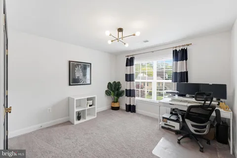 a utility room with sink dryer and washer