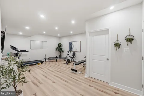 a bedroom with a bed and a flat tv screen