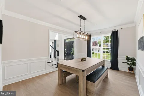 a view of a room with furniture window and wooden floor