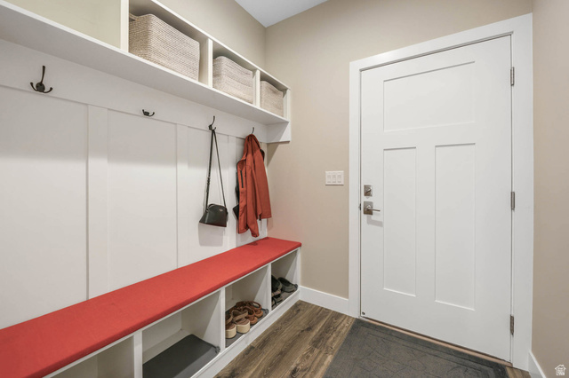 4527 North Seven Bridges Road Eden, UT 84310 - Photo 42 of 65 Mudroom featuring dark wood finished floors and baseboards