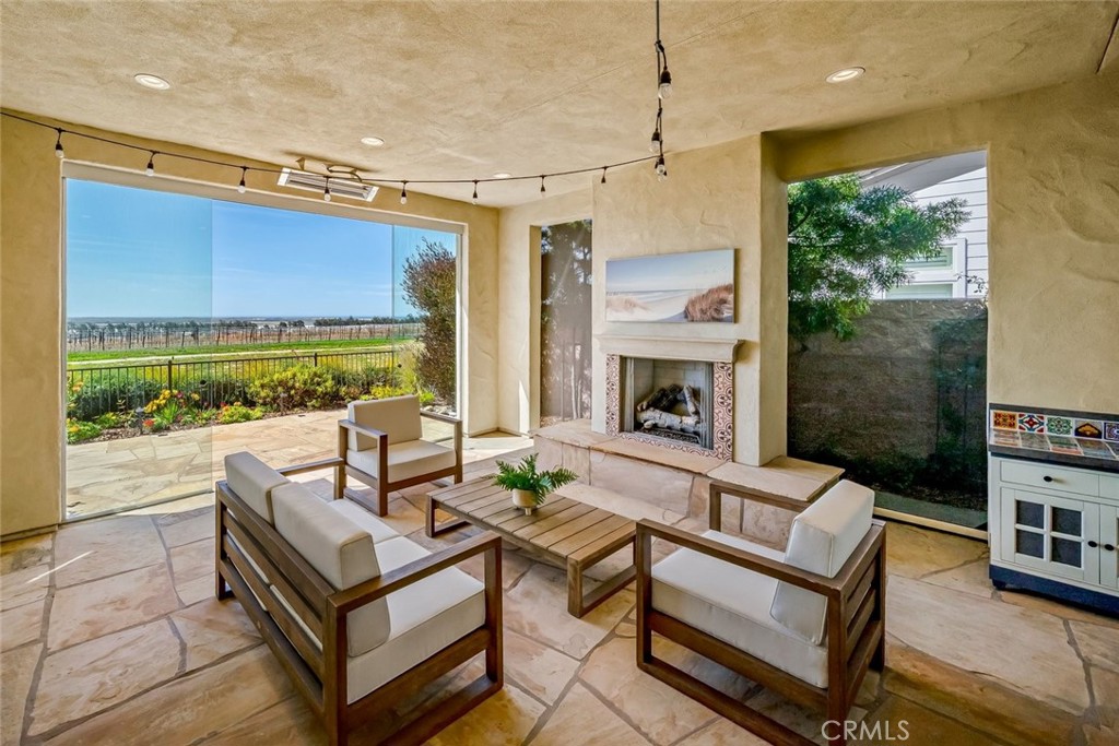 1590 Eucalyptus Road Nipomo, CA 93444 - Photo 16 of 75 a outdoor living space with furniture and a fireplace