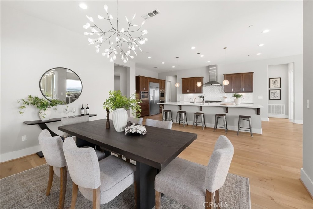 1590 Eucalyptus Road Nipomo, CA 93444 - Photo 23 of 75 a view of a dining room with furniture and wooden floor