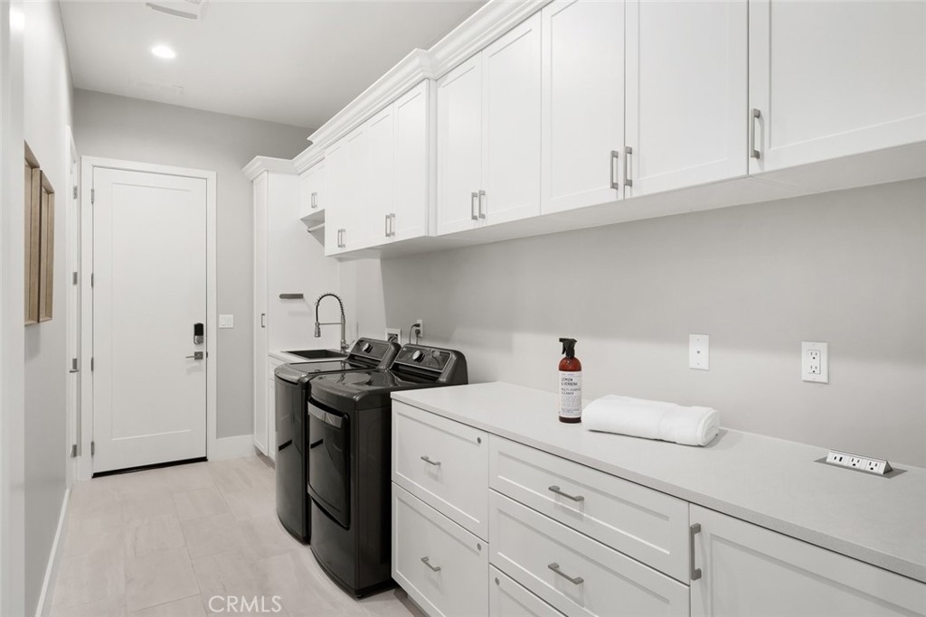 1590 Eucalyptus Road Nipomo, CA 93444 - Photo 39 of 75 a kitchen with a sink and cabinets