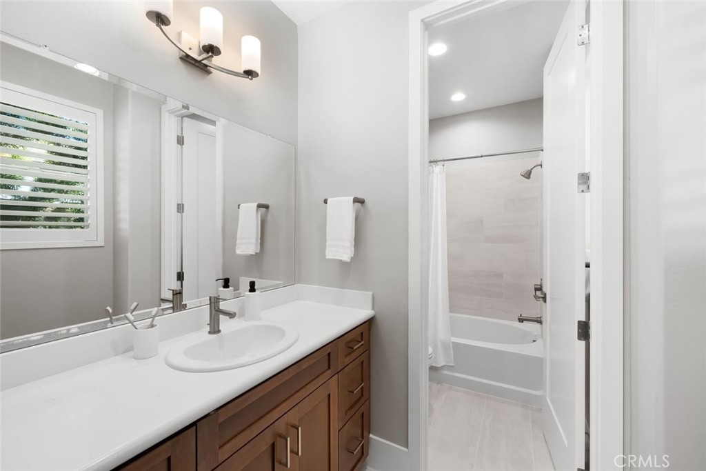 1590 Eucalyptus Road Nipomo, CA 93444 - Photo 46 of 75 a bathroom with a double vanity sink mirror and shower