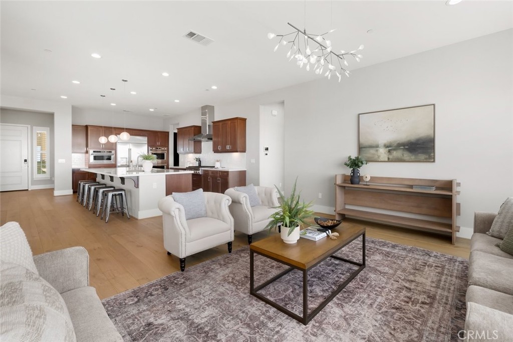 1590 Eucalyptus Road Nipomo, CA 93444 - Photo 5 of 75 a living room with furniture and a chandelier
