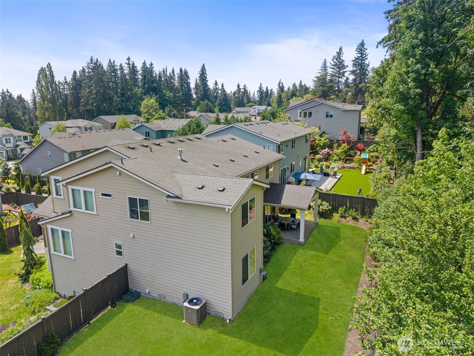 29 242nd Street Southeast Bothell, WA 98021 - Photo 35 of 40 a aerial view of a house with a big yard and large trees