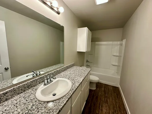 a view of yard with swimming pool and wooden fence